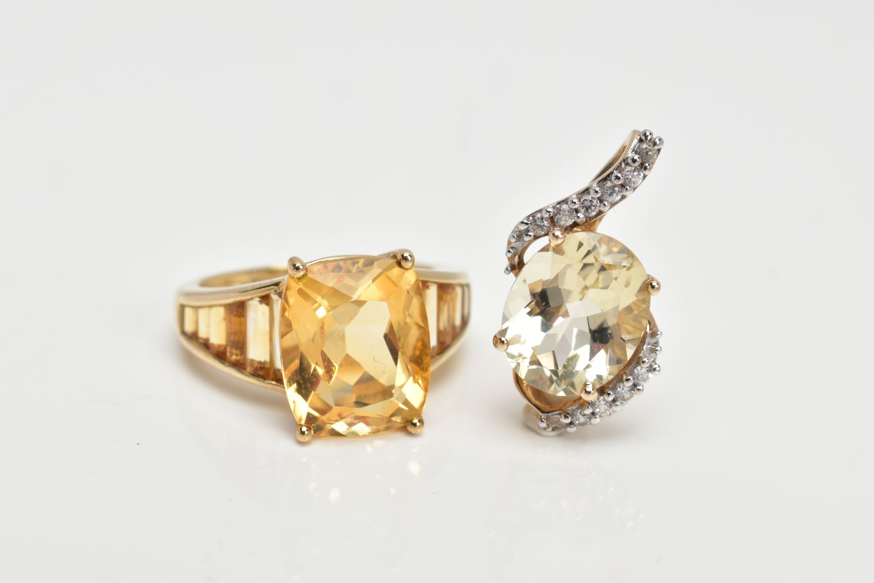 A 9CT GOLD CITRINE RING AND A PENDANT, the ring designed with a claw set, oval cut citrine,