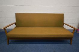 A MID 20TH CENTURY TEAK SOFA BED, with open armrests, length 201cm (this upholstery does not