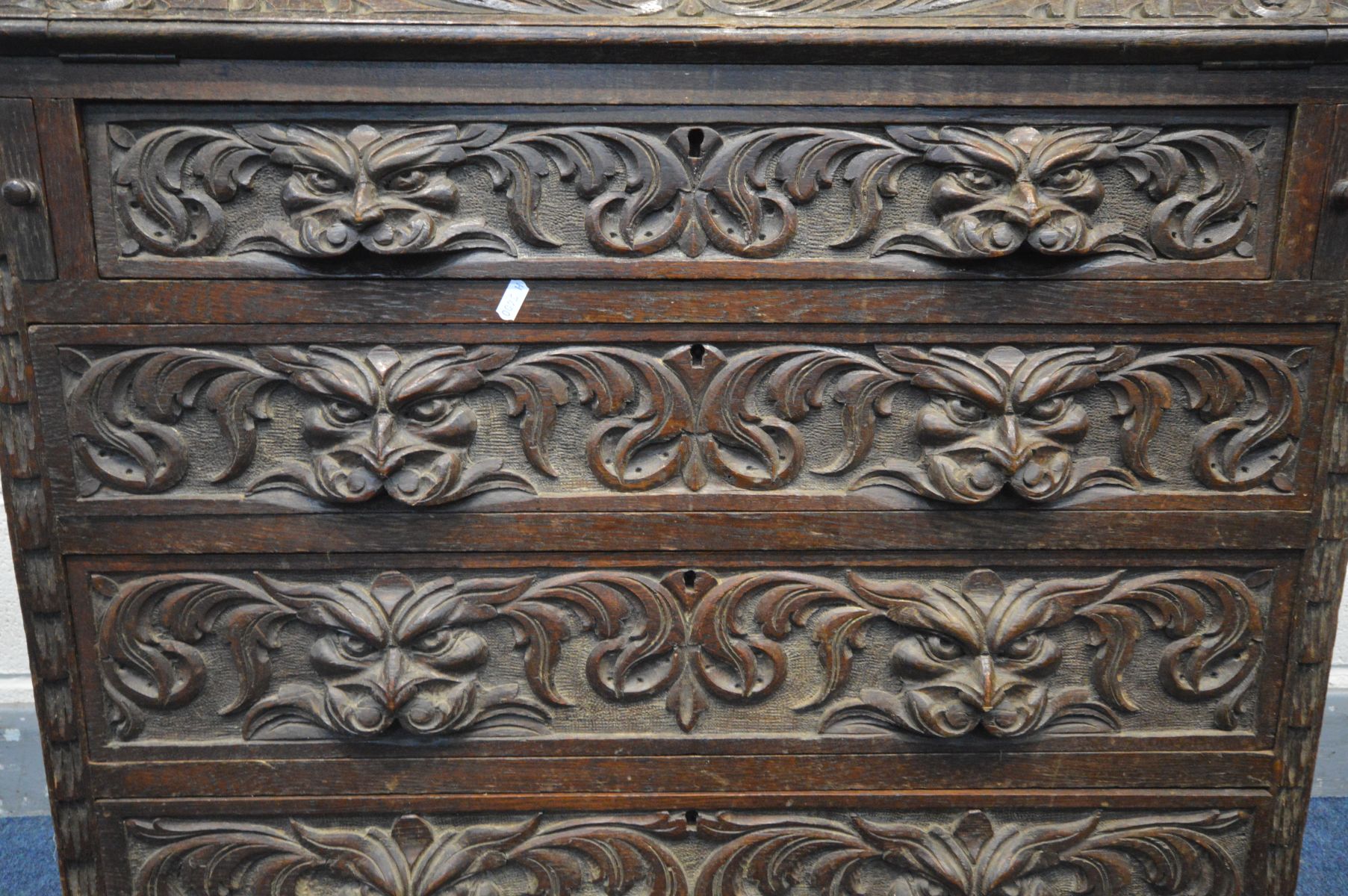 AN EARLY 20TH CENTURY CARVED OAK BUREAU, gallery top, the fall front with a fitted interior, above - Image 4 of 4