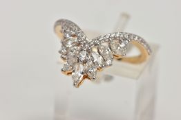 AN 18CT GOLD DIAMOND DRESS RING, the V-shape band set with brilliant cut diamonds, beneath a V-shape