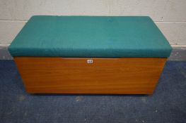 A MID CENTURY MEREDEW TEAK BLANKET BOX with turquoise upholstery, on casters, width 91cm x depth