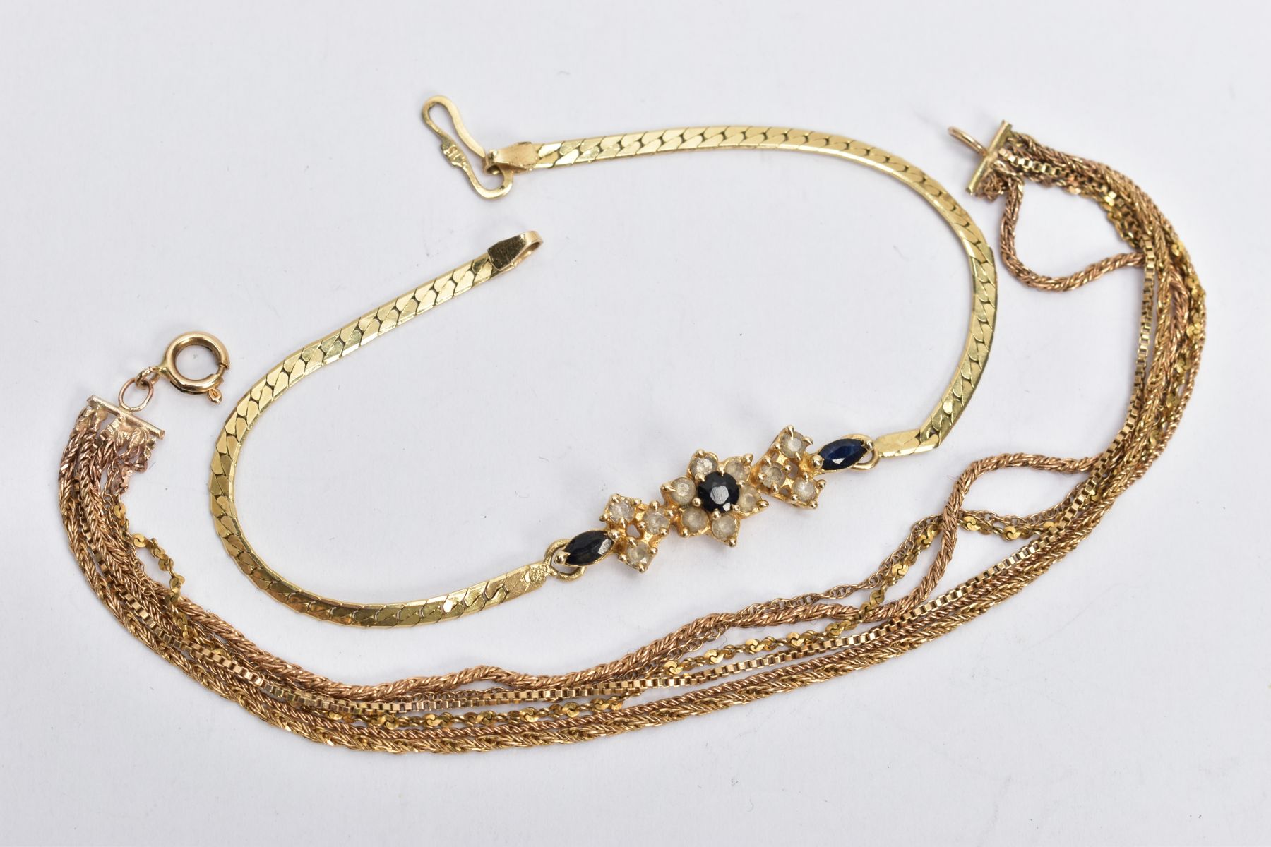 TWO BRACELETS, the first designed with a central elongated floral cluster panel of sapphire and