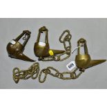 THREE BRASS WHALE OIL LAMPS, comprising a pair of late 19th Century examples and a late 18th/early