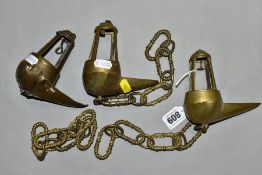 THREE BRASS WHALE OIL LAMPS, comprising a pair of late 19th Century examples and a late 18th/early