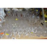 A QUANTITY OF CUT GLASS AND CRYSTAL DRINKING GLASSES, to include approximately seventy glasses,