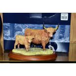 A BOXED BORDER FINE ARTS FIGURE GROUP, Highland Cow & Calf B167 designed by Anne Wall on wooden