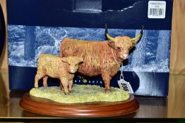 A BOXED BORDER FINE ARTS FIGURE GROUP, Highland Cow & Calf B167 designed by Anne Wall on wooden