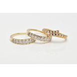 THREE 9CT GOLD DIAMOND RINGS, to include two eleven stone rings, each designed as graduated rows