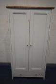 A PARTIAL OAK AND WHITE FINISH TWO DOOR WARDROBE, with a single drawer, width 104cm x depth 65cm x