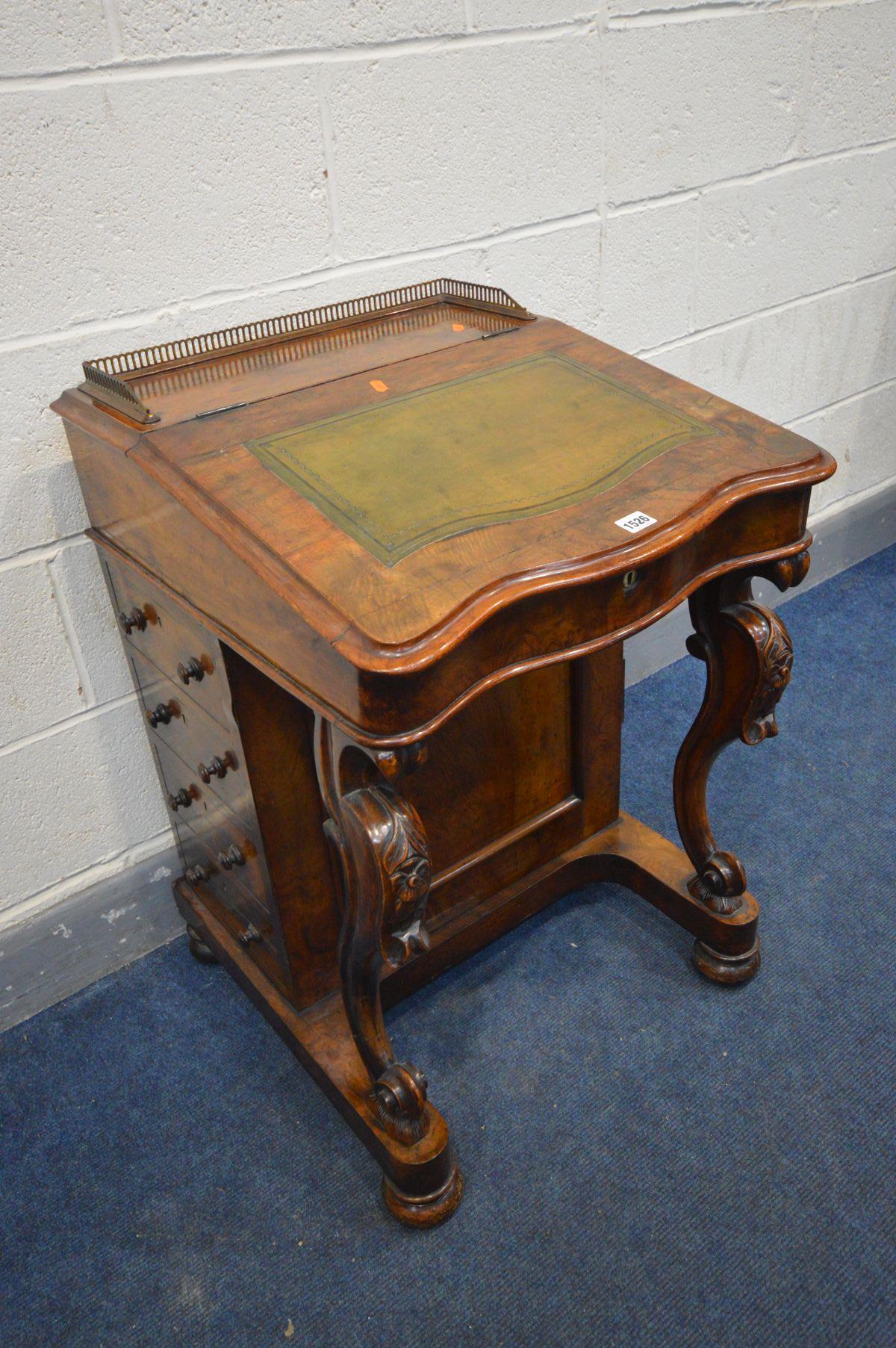 A VICTORIAN WALNUT DAVENPORT, brass gallery to top, a hinged leather tooled inlay lid enclosing a