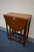 A SMALL OAK OVAL TOPPED GATE LEG TABLE, on chamfered legs