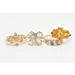 FOUR 9CT GOLD GEM SET DRESS RINGS, to include an orange sapphire seven stone ring, a marquise