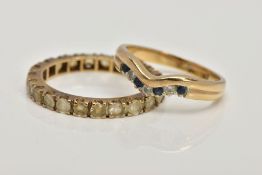 A 9CT GOLD DIAMOND AND SAPPHIRE WISHBONE RING AND A YELLOW METAL FULL ETERNITY RING, designed with a