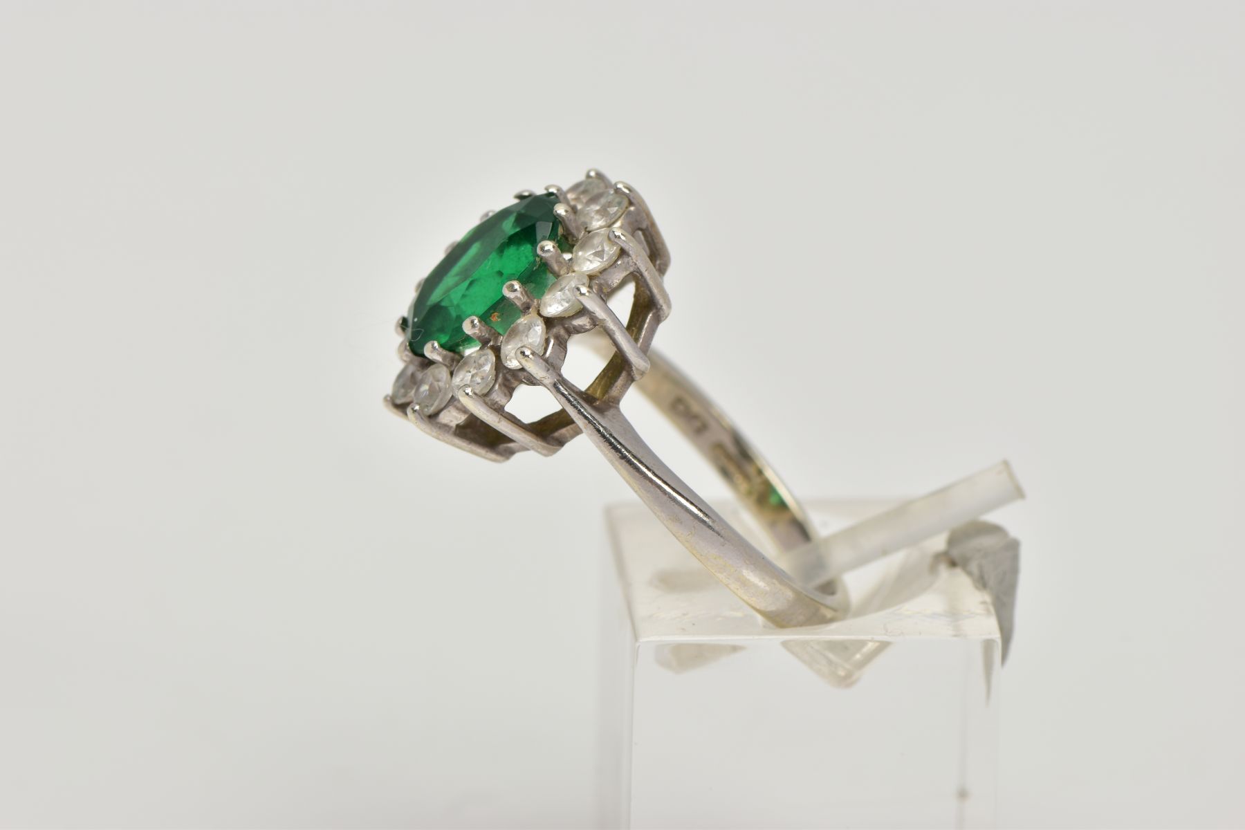 A 9CT WHITE GOLD CLUSTER RING, designed with a central green stone assessed as paste, within a - Image 2 of 5