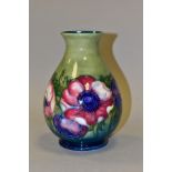 A MOORCROFT POTTERY SQUAT BALUSTER VASE, Anemone pattern on green ground, impressed backstamp and