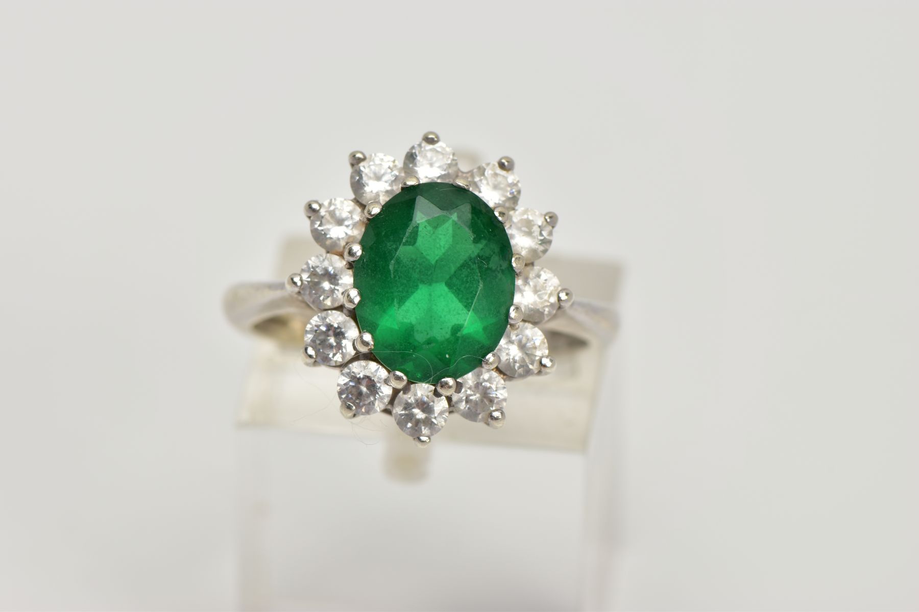 A 9CT WHITE GOLD CLUSTER RING, designed with a central green stone assessed as paste, within a - Image 5 of 5