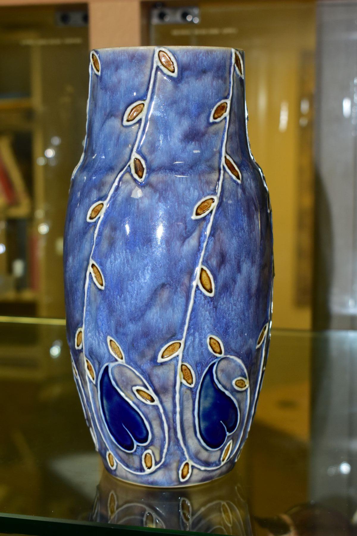 A ROYAL DOULTON STONEWARE VASE, to include foliage decoration on mottled lavender ground,