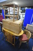 A WICKER AND BEECH KITCHEN TABLE and two chairs, along with a wicker blanket chest and a two tier