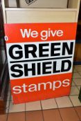 A 'WE GIVE GREEN SHIELD STAMPS' ADVERTISING SIGN, lithographed aluminium sign, white lettering on