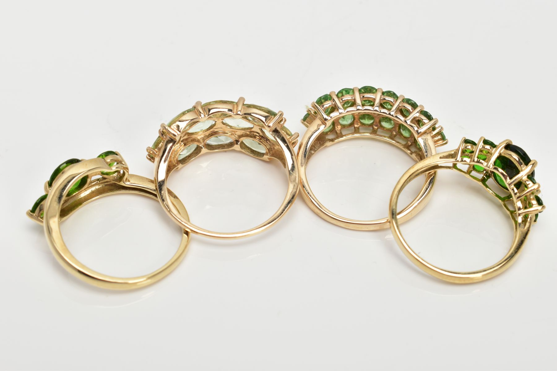 FOUR 9CT GOLD GEMSET RINGS, to include a three stone ring, assessed as circular cut diopside, - Image 3 of 3