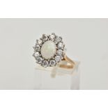 A 9CT GOLD OPAL AND CUBIC ZIRCONIA CLUSTER RING, of an oval design, set with a central oval opal
