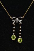 A YELLOW METAL PERIDOT AND SEED PEARL PENDANT NECKLACE, the pendant of a bow shape set with single