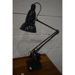 A HEBERT TERRY BLACK FINISH ANGLE POISE DESK LAMP, on a stepped base