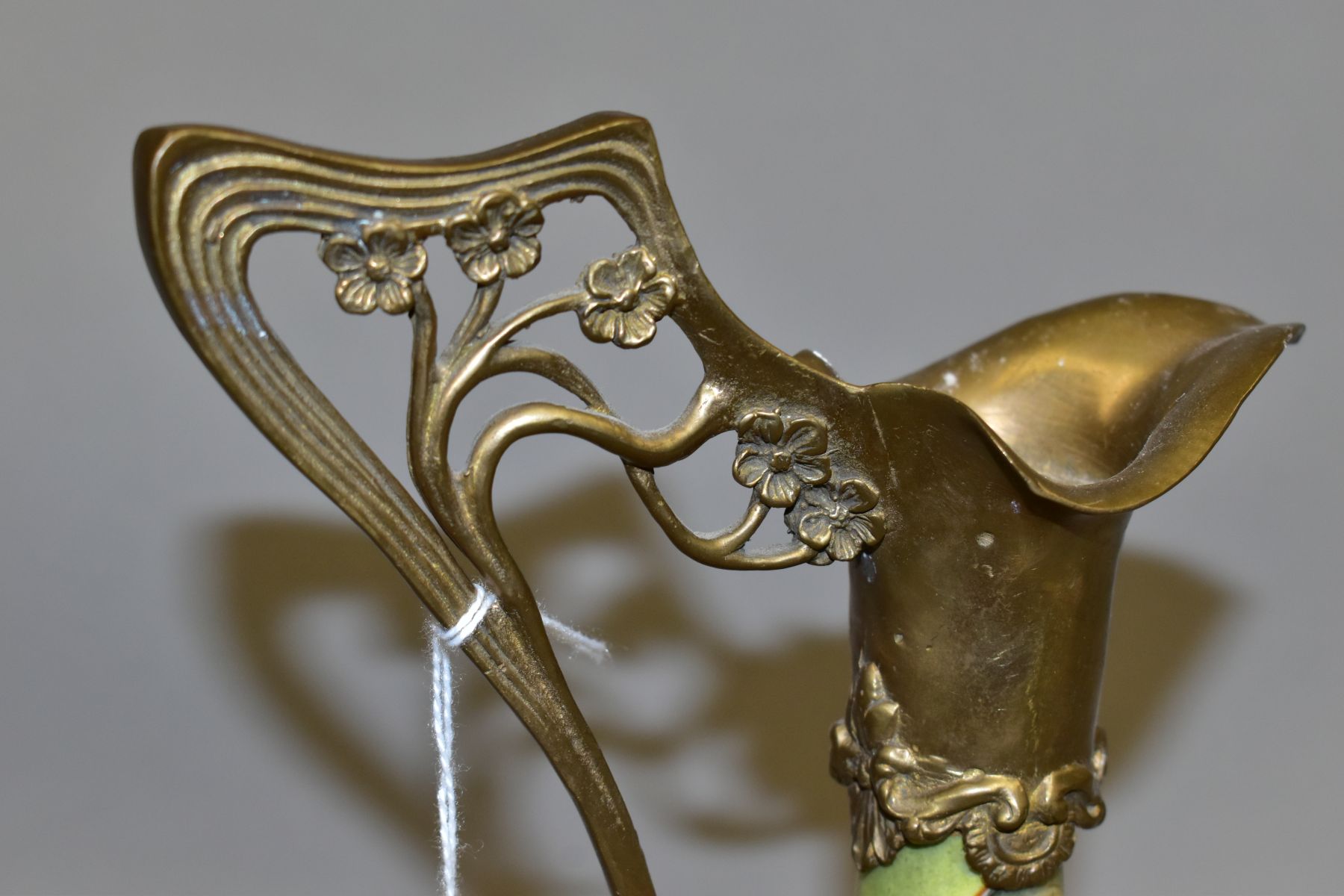 A REPRODUCTION ART NOUVEAU STYLE BRASS MOUNTED CERAMIC EWER, with foliate stopper, the wavy lip with - Image 7 of 7