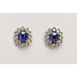 A PAIR OF 18CT GOLD SAPPHIRE AND DIAMOND CLUSTER STUD EARRINGS, designed as a central oval