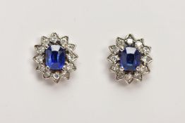 A PAIR OF 18CT GOLD SAPPHIRE AND DIAMOND CLUSTER STUD EARRINGS, designed as a central oval