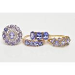 FOUR 9CT GOLD TANZANITE RINGS, to include a three stone tanzanite ring, oval cut, prong set,