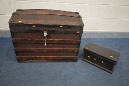 AN EARLY 20TH CENTURY CANVAS AND WOODEN BANDED DOMED TRUNK, to inside of lid 'T.EVINS, PRACTICAL