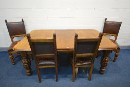 AN EARLY 20TH CENTURY OAK WIND OUT DINING TABLE, with an additional leaf, on acorn and turned