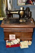 A CASED VINTAGE 'JONES' SEWING MACHINE, No. 87445, with a small box of threads, etc