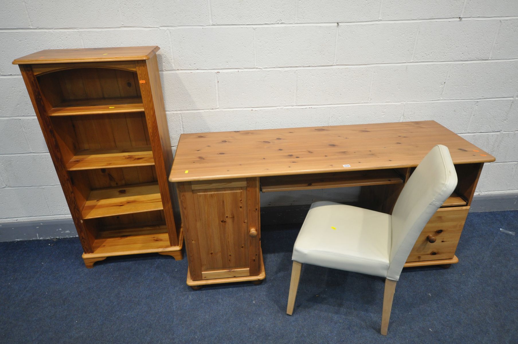 A MODERN PINE DESK, width 154cm x depth 54cm x height 74cm, cream leatherette chair and an open