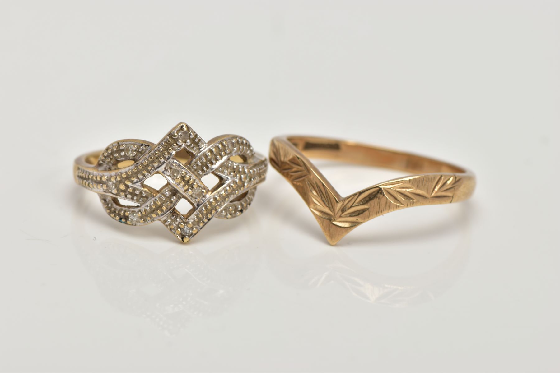 A 9CT GOLD DIAMOND RING AND A WISHBONE RING, the openwork ring set with single cut diamond detail,