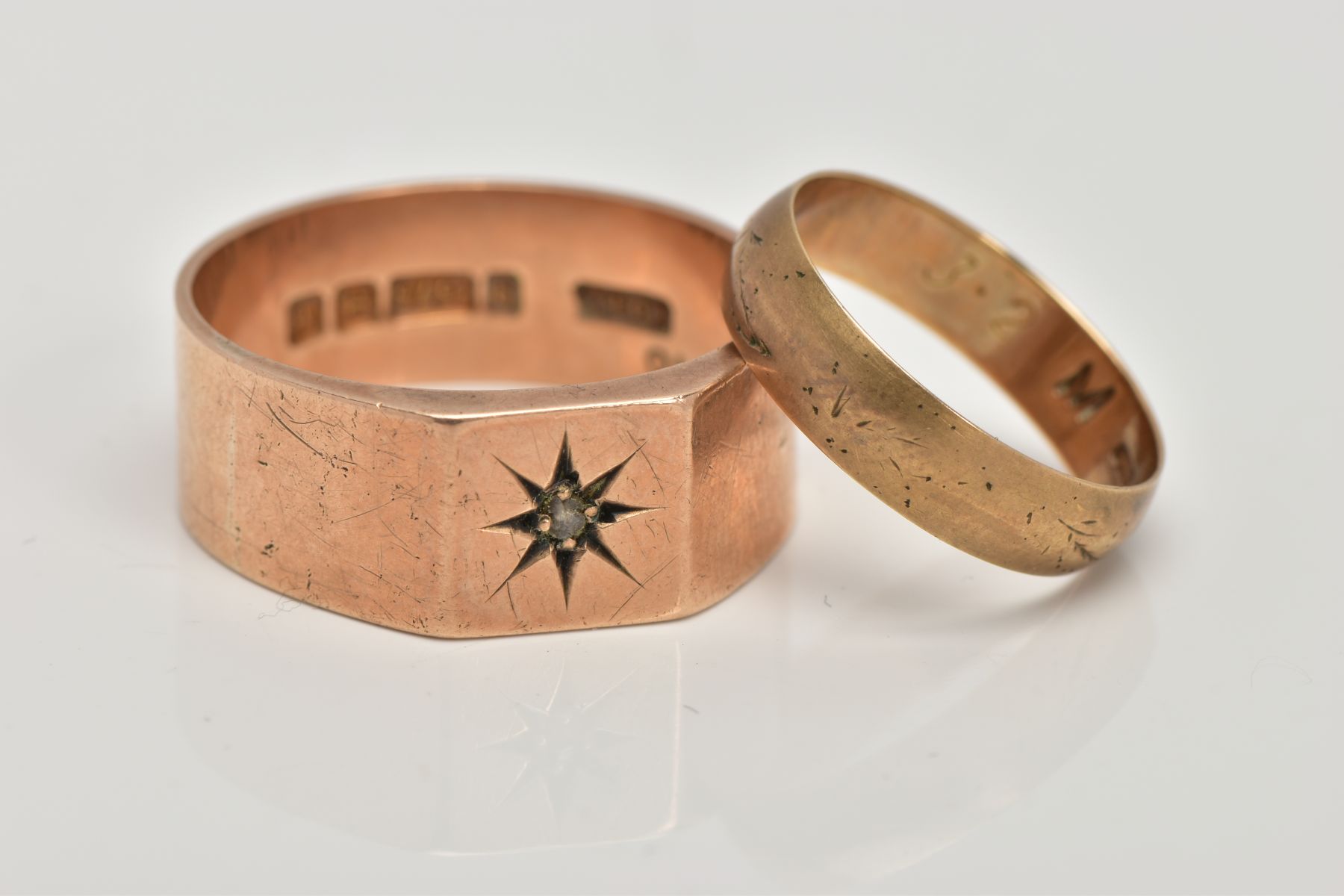 TWO 9CT GOLD RINGS, the first a signet ring with a rough cut diamond star set to the centre, ring