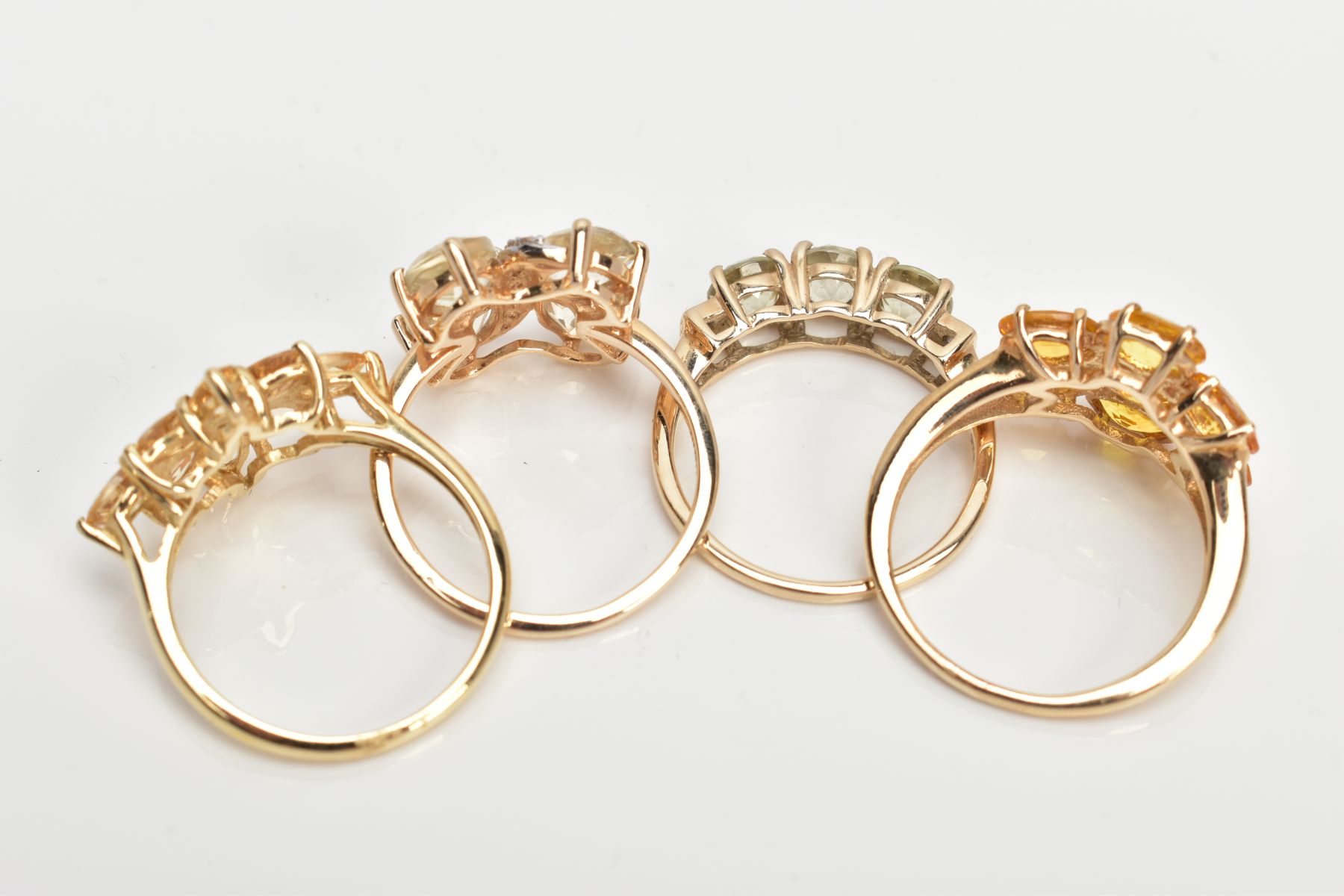 FOUR 9CT GOLD GEM SET DRESS RINGS, to include an orange sapphire seven stone ring, a marquise - Image 3 of 3