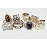 A BAG OF ASSORTED SILVER AND WHITE METAL RINGS, twelve rings in total, various styles and designs,