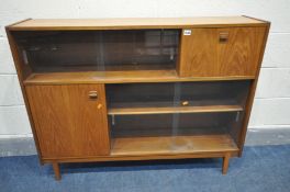 A NATHAN TEAK BOOKCASE, with an arrangement of glazed and wooden doors, width 128cm x depth 22cm x