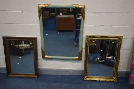 A GREEN PAINTED AND GILT FRAMED WALL MIRROR, 105cm x 80cm, an gilt framed bevelled edge wall