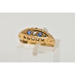 AN EARLY 20TH CENTURY, 18CT GOLD SAPPHIRE AND DIAMOND BOAT RING, the central piece set with two