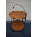 A MID CENTURY CHROME AND ROSEWOOD EFFECT CIRCULAR FOLDING TEA TROLLEY