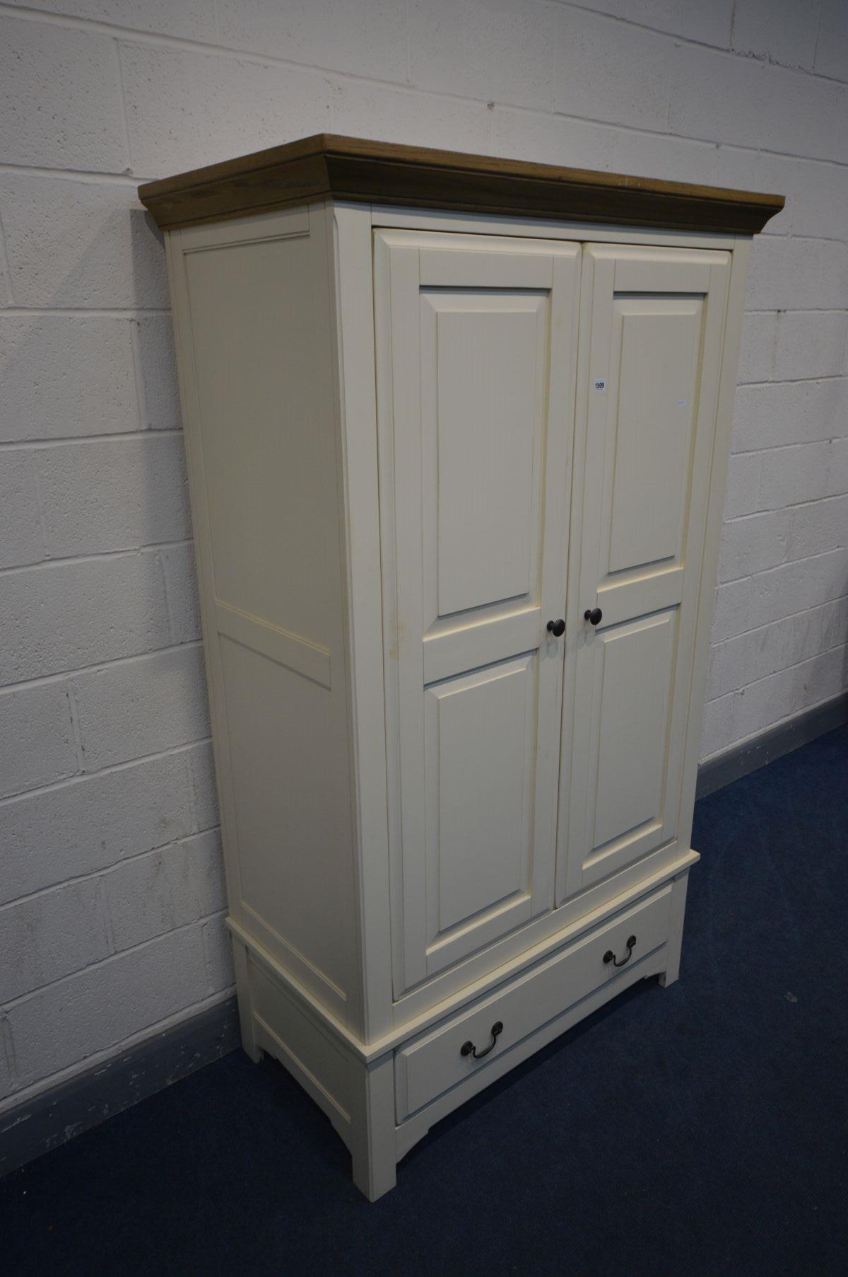AN OAK AND PARTIALLY PAINTED CREAM DOUBLE DOOR WARDROBE with a single drawer, width 114cm x depth - Image 2 of 4
