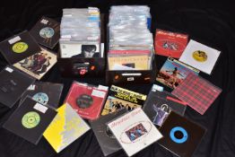 TWO TRAYS CONTAINING OVER ONE HUNDRED AND FIFTY 7in SINGLES AND EPs from artists such as Status Quo,