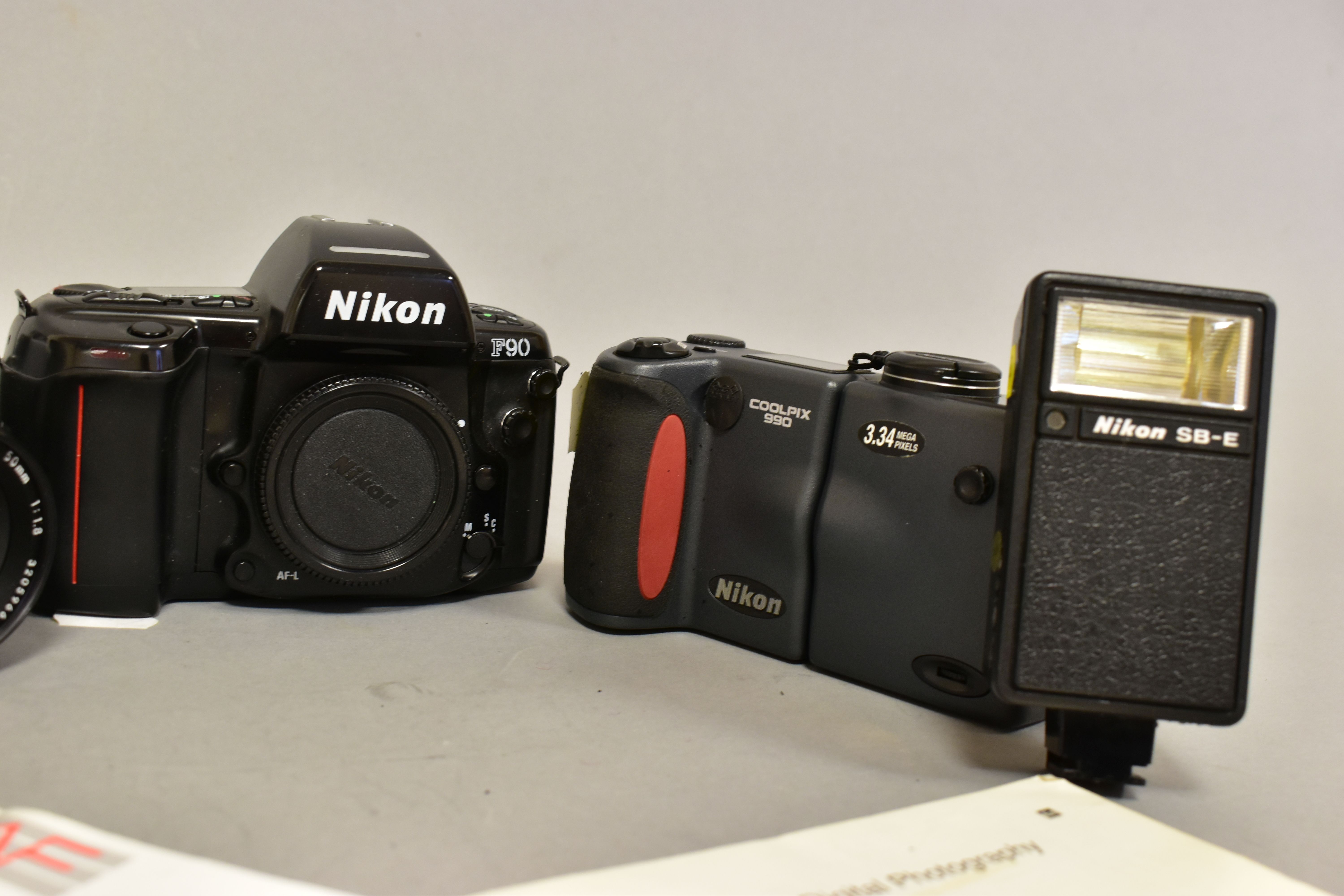 A NIKKORMAT FT FILM SLR CAMERA fitted with a 50mm f1.8 lens, a 24mm f2.8 lens, a F90 film SLR - Image 3 of 4