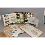 MAINLY GB COLLECTION OF STAMPS IN FOUR ALBUMS, mostly decimal with mint selections to approx. 1990