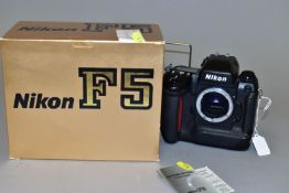 A BOXED NIKON F5 FULL FORMAT FILM CAMERA BODY with manual