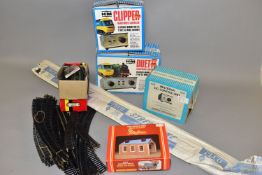 A QUANTITY OF BOXED AND UNBOXED OO GAUGE RAILWAY TRACK AND CONTROLLERS ETC, to include boxed H & M