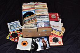 A TRAY CONTAINIG APPROX THREE HUNDRED 7in SINGLES artists include Slade, The Charlatans, Bread, John